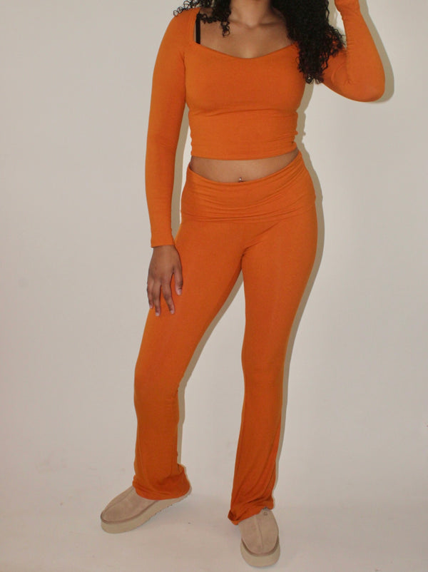 6’1 tall girl wearing WEXIST matching set made for tall girls in orange