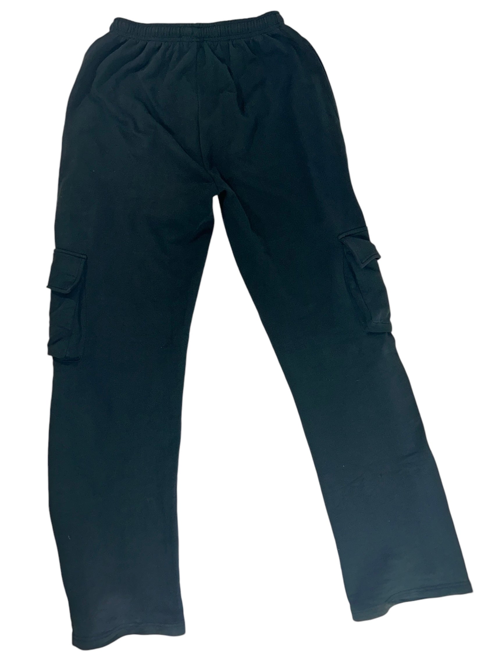 Back view of stylish black cargo pants for tall women, featuring multiple pockets and a relaxed fit