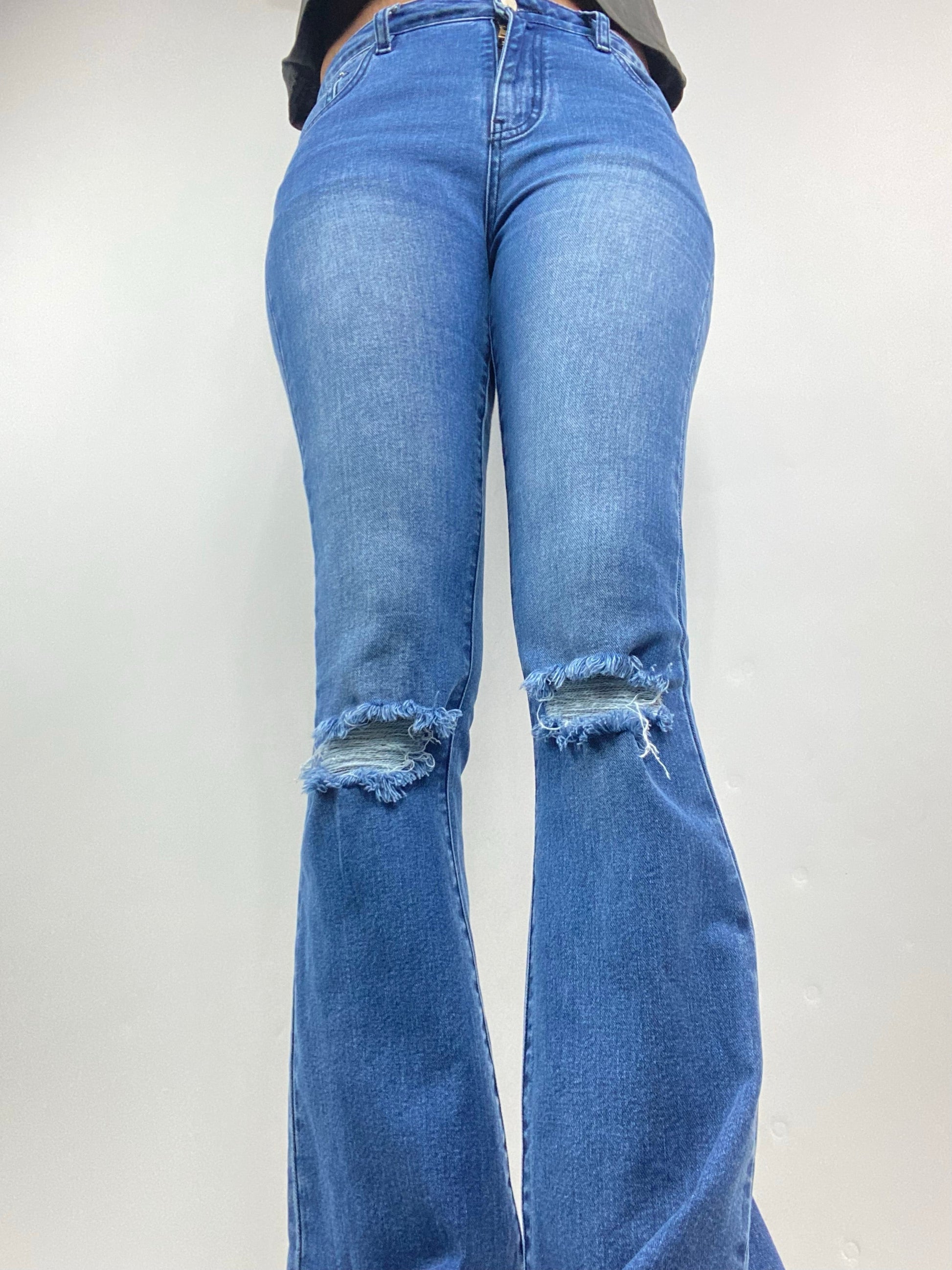 tall girl flared jeans in light blue wash with distressed knee